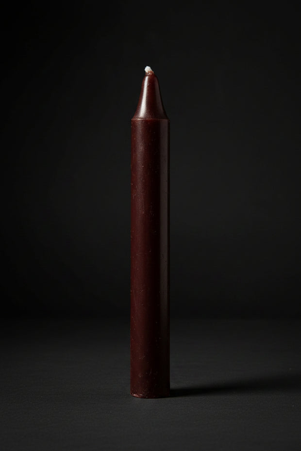 Brown chime candle on a plain background