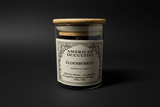 Organic dried elderberries (Sambucus nigra) in a labeled glass ritual herb jar