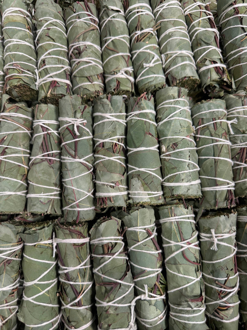 Stack of green bundles wrapped with white string