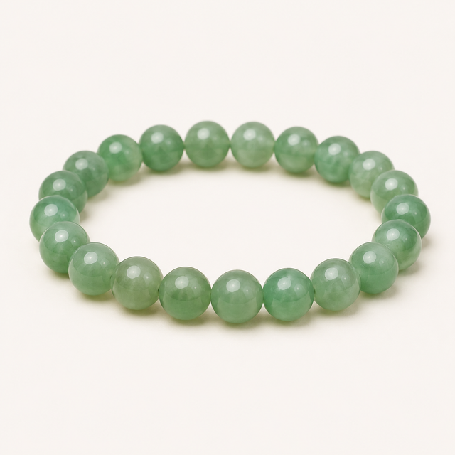 Faceted green agate beaded stretch bracelet with translucent green tonal variation.