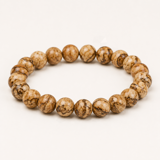 Representative faceted bracelet sold as Leopardite with tan, brown, and black spotted beads; pattern and bead details vary