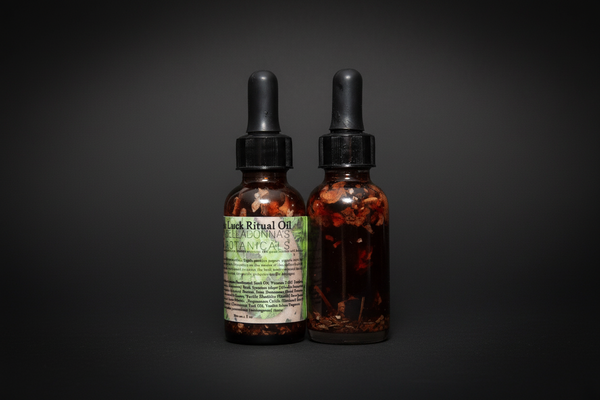Two bottles of Luck Ritual Oil with dropper lids on a white background