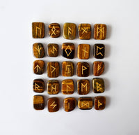 Set of wooden runes with engraved symbols on a white background