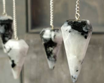 Crystal pendulums on a neutral background