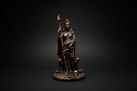 Hecate-inspired statue holding a staff shown from the front