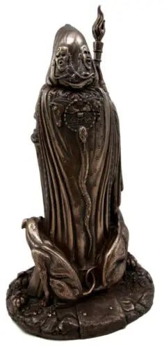 Bronze statue of a figure in robes with a staff on a white background
