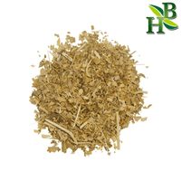 Heap of dried herbs on a white background with a visible brand logo in the corner.