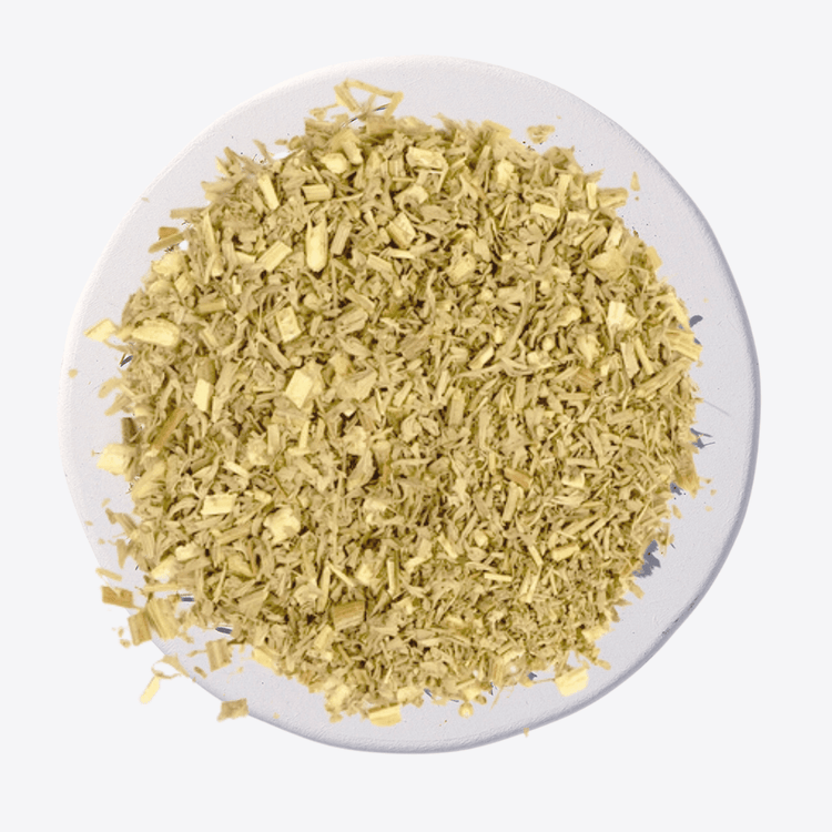Dry herb or spice on a white plate with a plain background