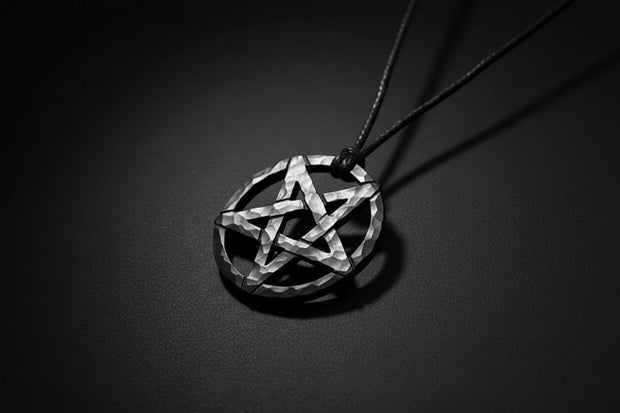 Pentagram pendant on a cord against a wooden background