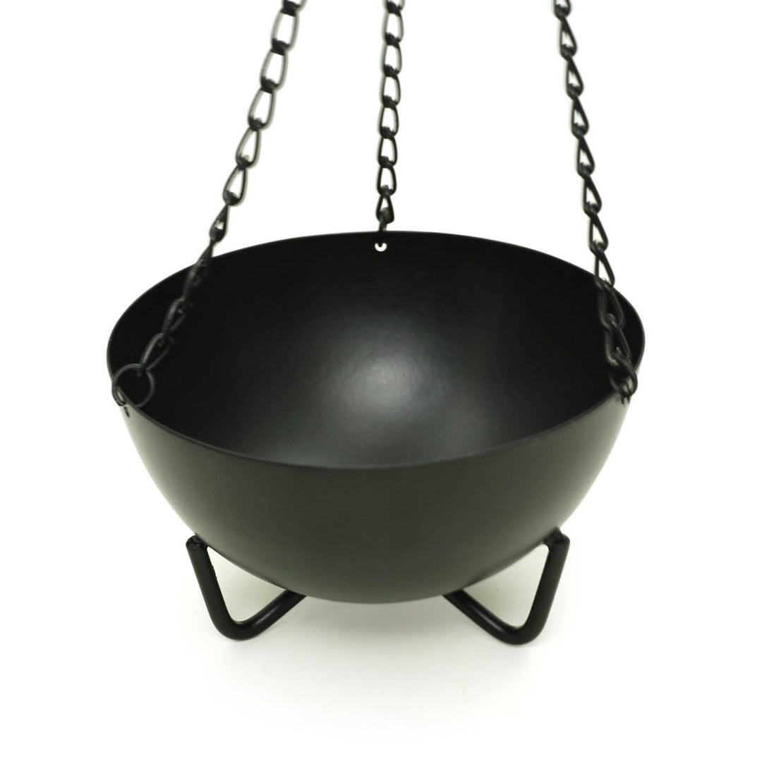 Large hanging cauldron burner shown with chain
