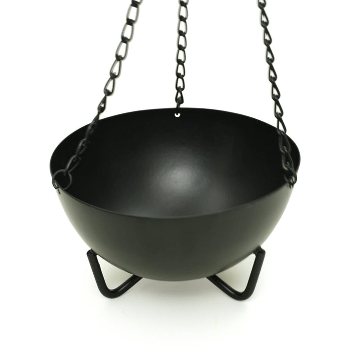 Large hanging cauldron burner shown with chain