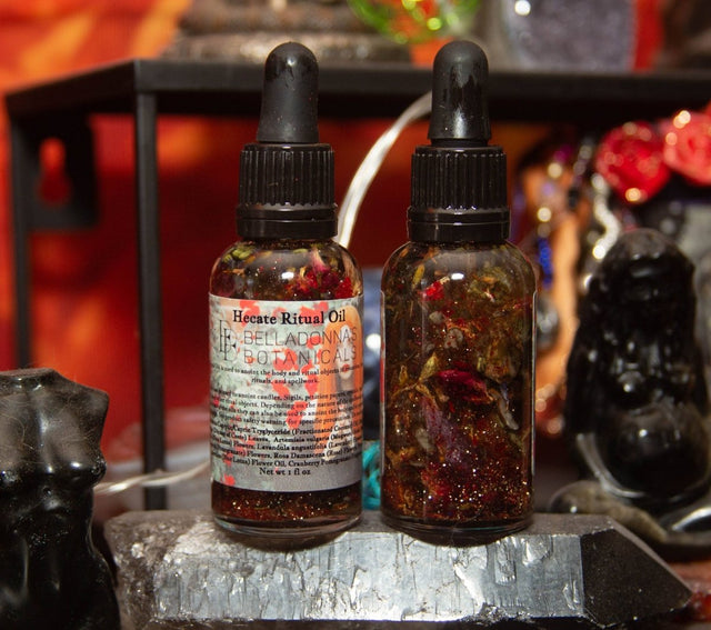 Two bottles of 'Necrotic Ritual Oil' on a dark surface with a blurred background.