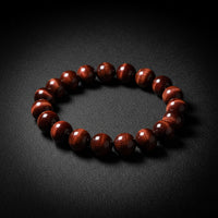 Red Tiger's Eye beaded stretch bracelet with reflective banding