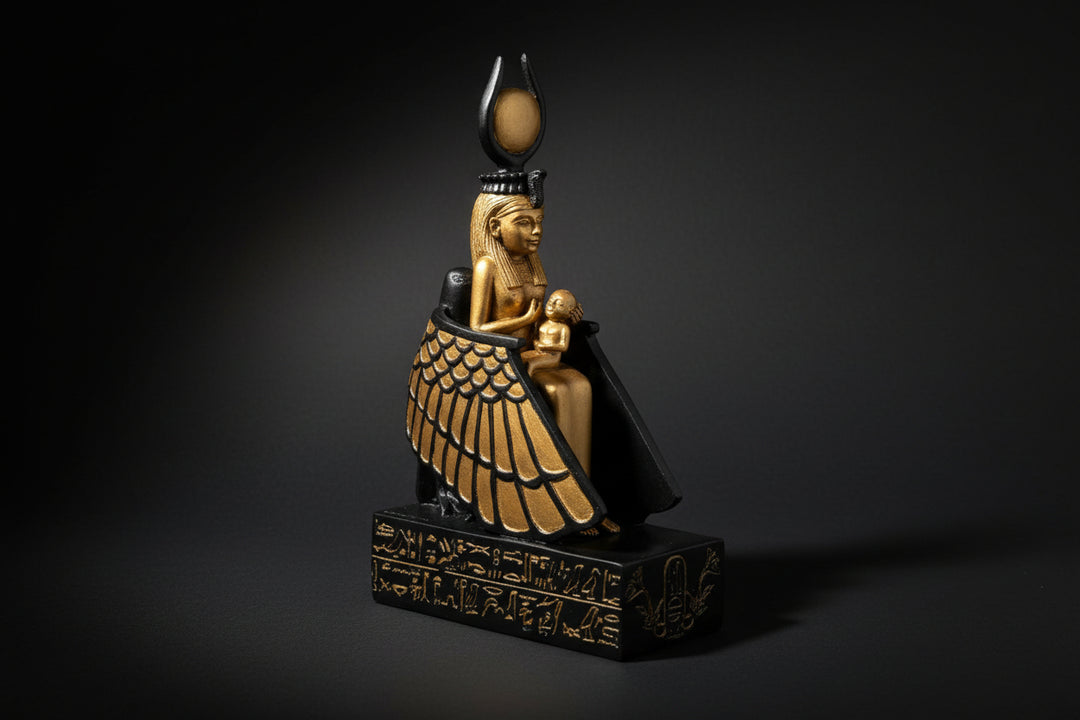 Statue of a winged figure with a headdress on a white background