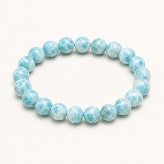 Representative polished beaded stretch bracelet sold as Larimar; blue-to-white pattern, Dominican locality, selected bead size, fit, treatment, and exact condition vary