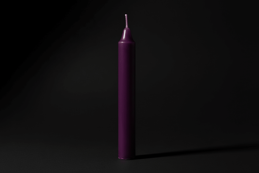 Lavender chime candle on a plain background