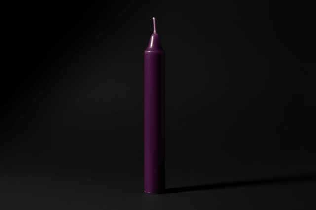 Lavender chime candle on a plain background