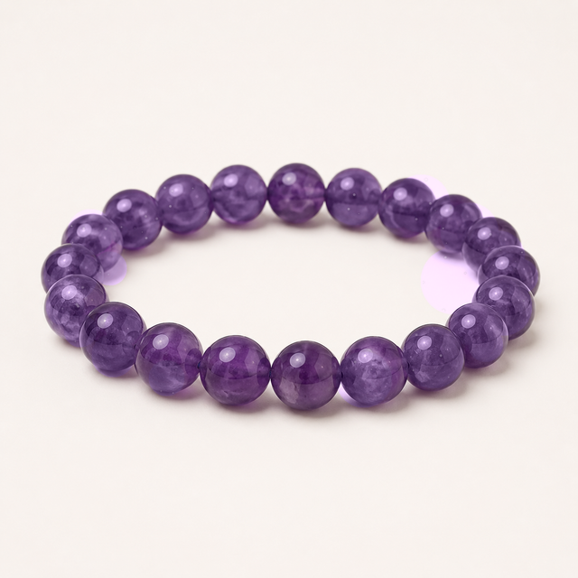Representative polished stretch bracelet sold as Lepidolite; exact mica species, treatment, lavender-purple color, mica-like flecks, bead condition, fit, and condition vary