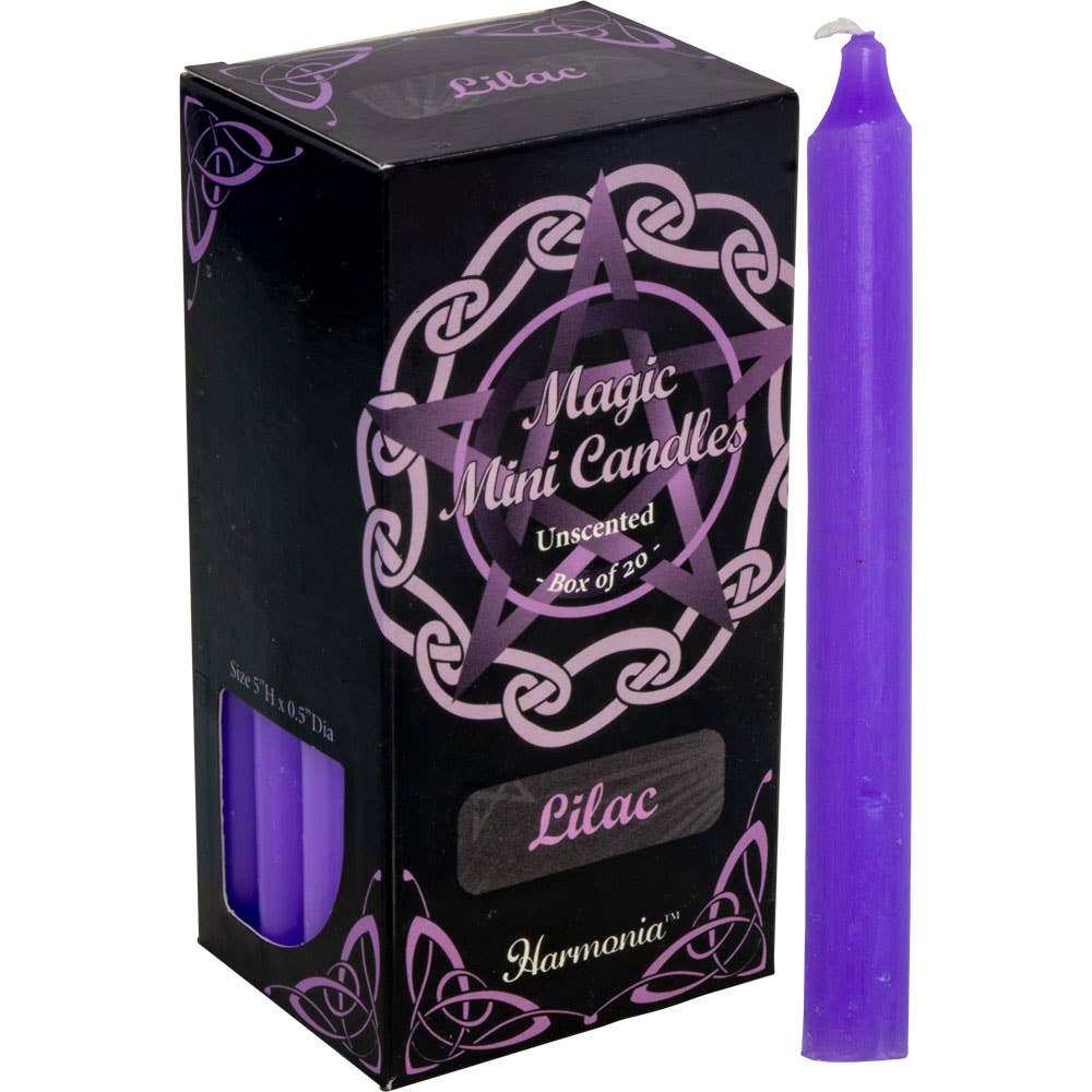 Purple candle next to its packaging with 'Harmonia' branding on a white background