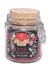 Glass jar with cork lid labeled 'Love & Attraction' on a white background