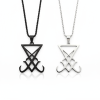 Two necklaces with geometric designs on a white background