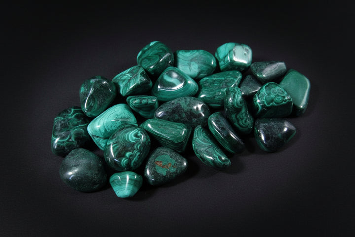 Polished green-banded Malachite tumbled stone