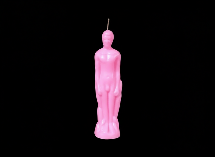 Colorful candle figurines arranged in a row against a black background