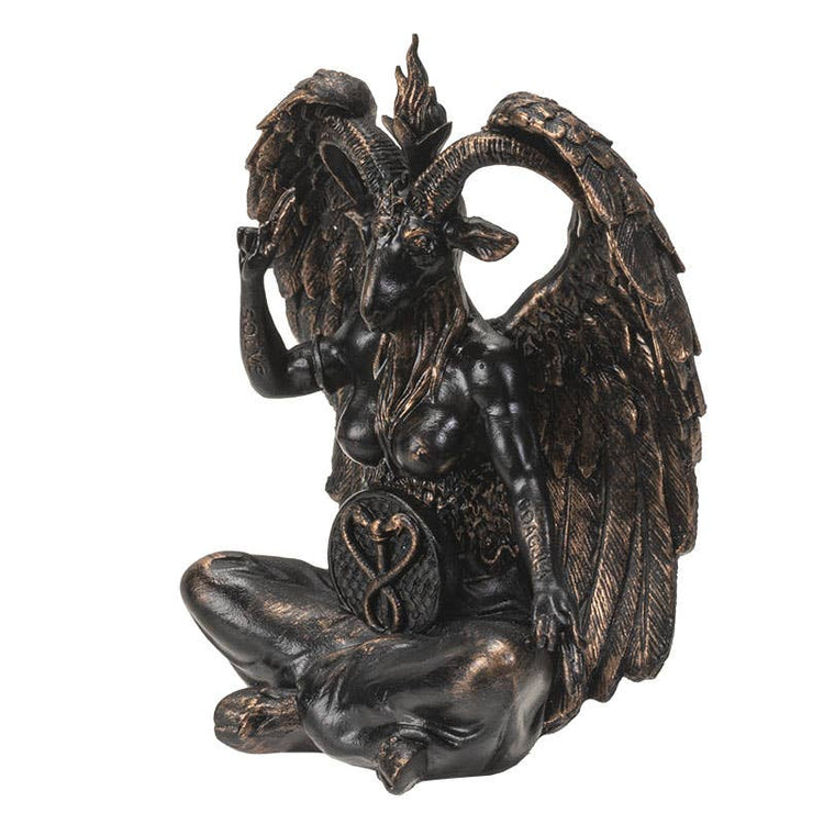 Statue of a winged creature with a horned head on a white background