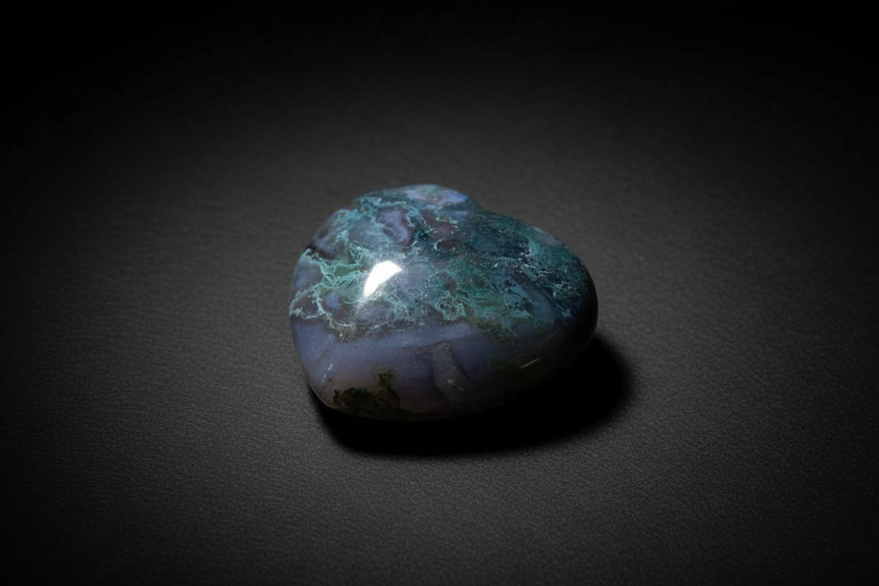 Polished heart-shaped Moss Agate stone with natural inclusions