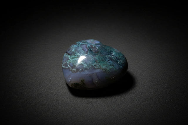 Polished heart-shaped Moss Agate stone with natural inclusions