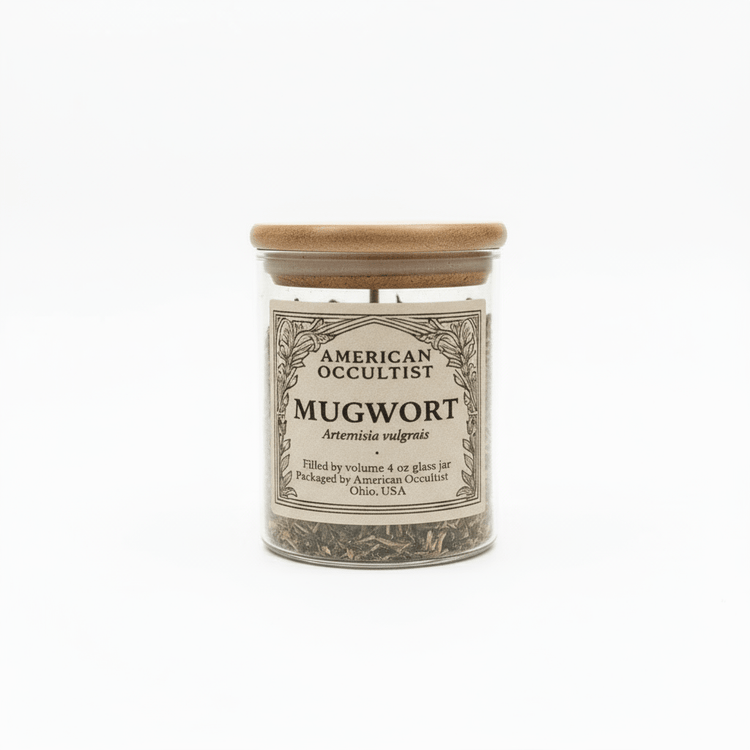 Jar of mugwort with a wooden lid on a white background