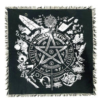 Black square altar cloth with white symbols and designs, including a pentagram, on a white background.