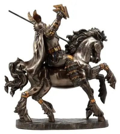 Statue of a warrior on horseback with a spear, detailed in bronze.