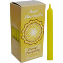 Yellow candle with packaging labeled 'Magic Mini Candles Orange Prosperity' by Harmonia on a white background.
