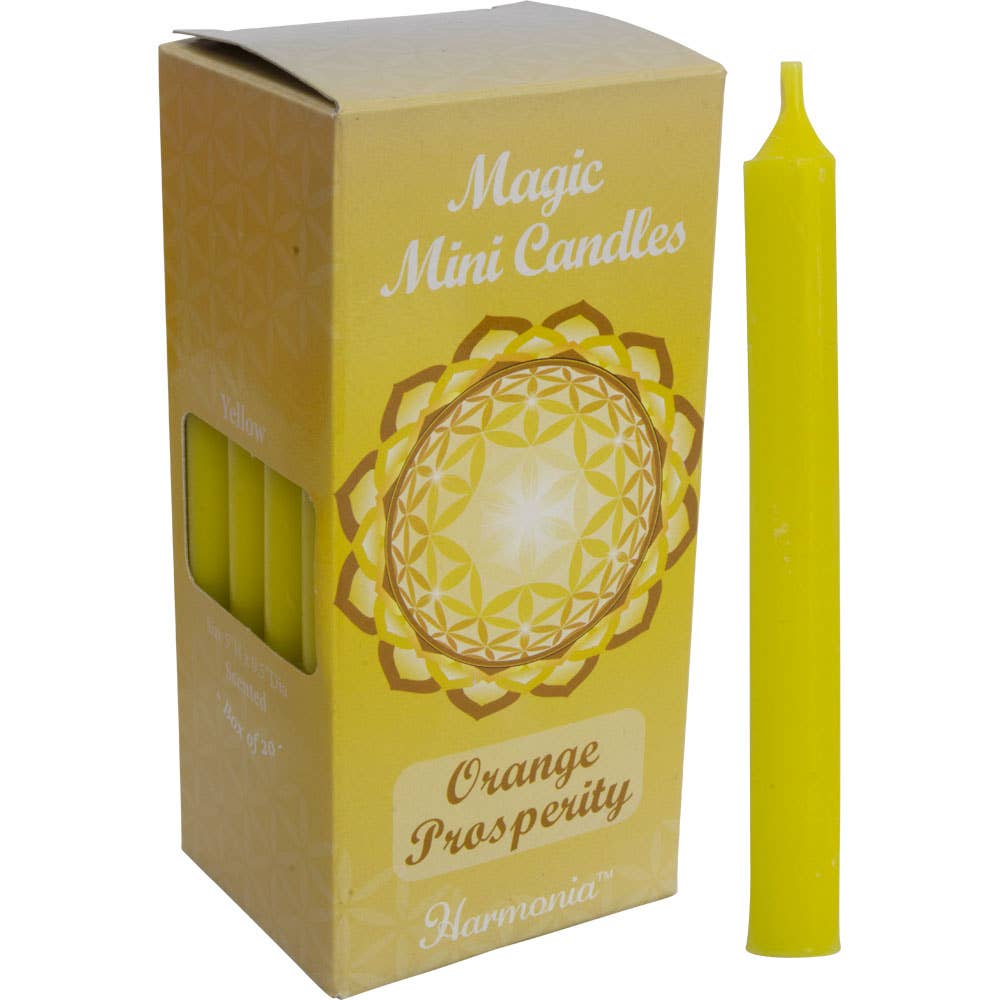 Yellow candle with packaging labeled 'Magic Mini Candles Orange Prosperity' by Harmonia on a white background.