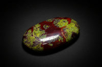 Polished Dragon Blood Jasper palm stone with green and red natural patterning
