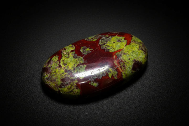 Polished Dragon Blood Jasper palm stone with green and red natural patterning