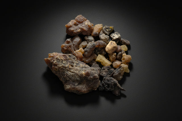Collection of various colors of palo santo resin on a white background