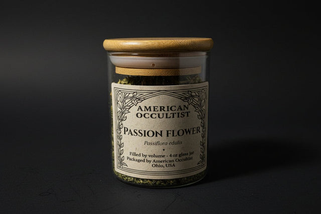 A jar with the passion flower herb in it on a black background.