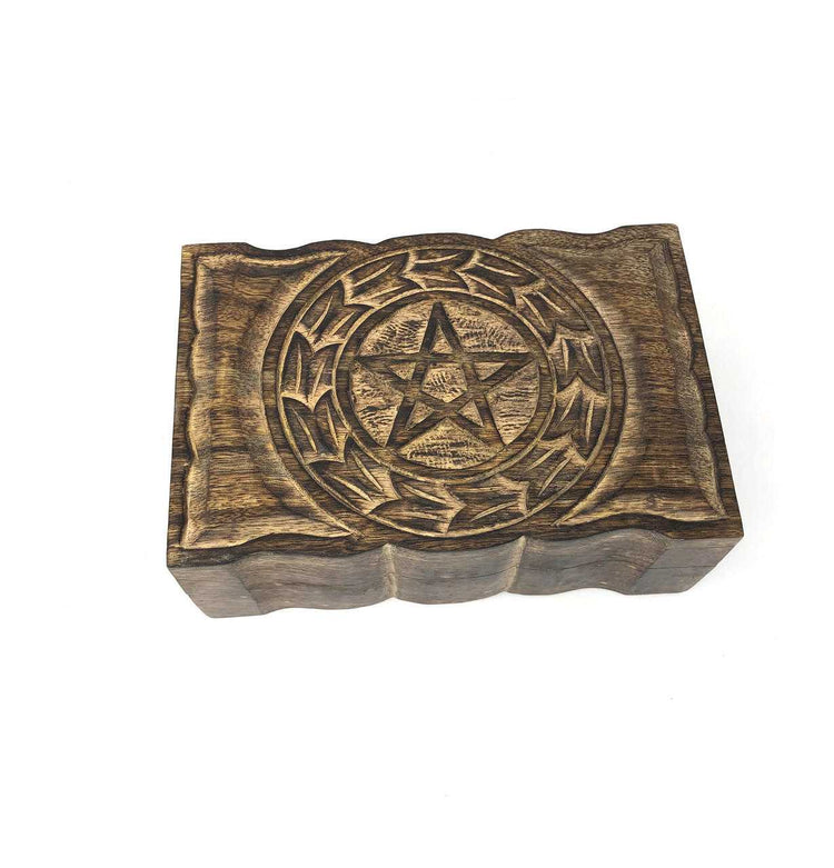 Wooden block with pentagram design on a white background