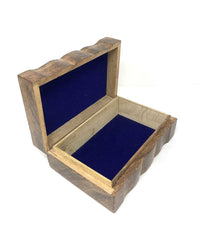 Wooden jewelry box with blue interior on a white background