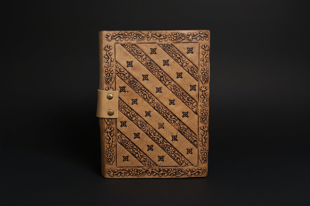 Pentagram broom leather journal shown open with deckle-edge pages