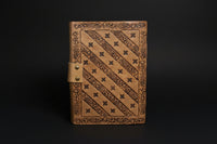 Pentagram broom leather journal shown open with deckle-edge pages