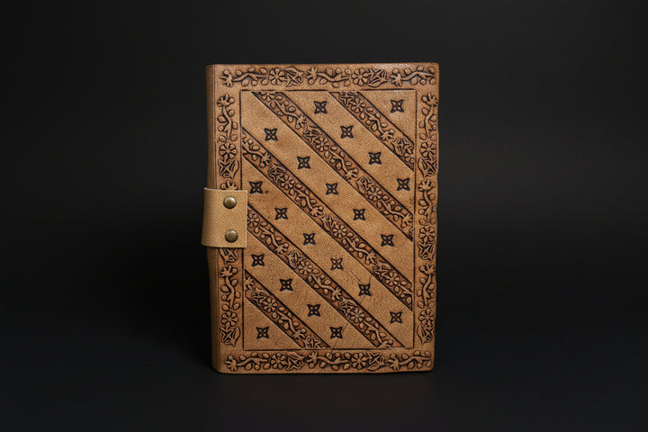 Pentagram broom leather journal shown open with deckle-edge pages