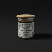 Dried cut-and-sifted peppermint leaf (Mentha × piperita) in a labeled glass ritual herb jar