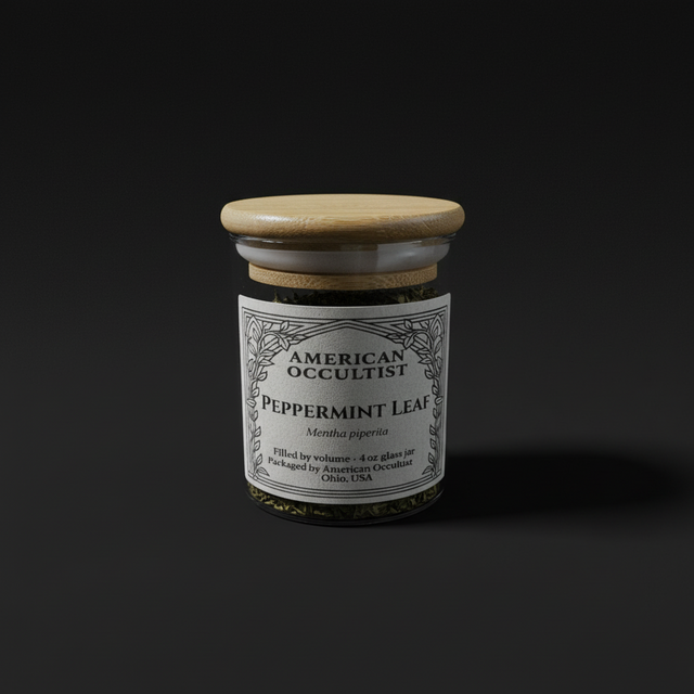 Dried cut-and-sifted peppermint leaf (Mentha × piperita) in a labeled glass ritual herb jar