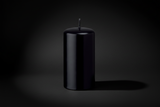 Black candle on a white background