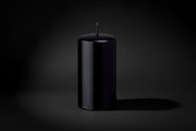 Black candle on a white background