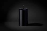 Black candle on a white background