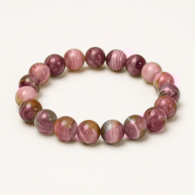 Polished round pink Mexican agate beaded stretch bracelet with pink, cream, and warm brown banding.